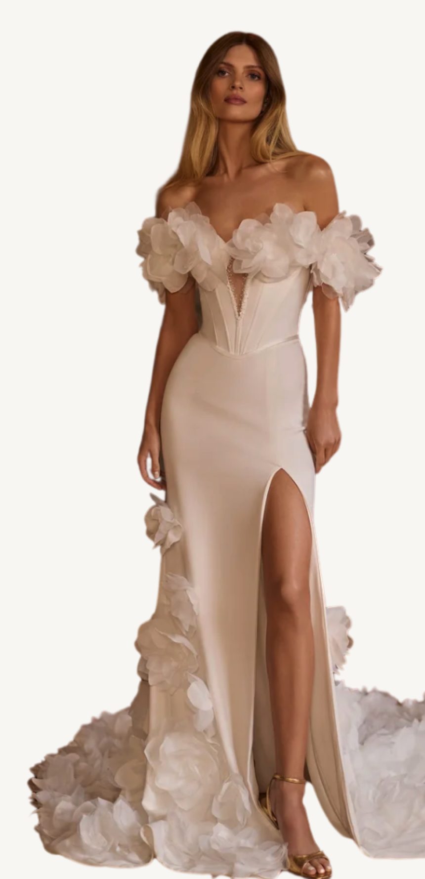 A model in an off-the-shoulder gown with sculptural floral details