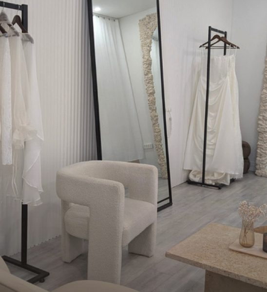 The Voliamo boutique: a mirror, gown rail and armchair